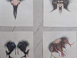 quatre cartes sur lesquelles sont représentés différents animaux, posées sur une surface en marbre
