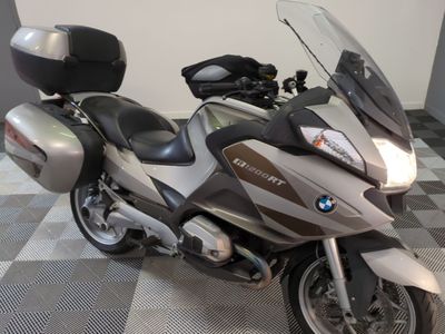 a motorcycle that is parked on a checkered floor