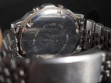 a close up of a wrist watch with a metal band