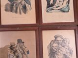 six framed pictures of a man and a woman on the wall
