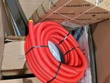 a red hose that is in a cardboard box