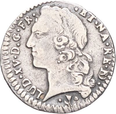 une pièce d'argent portant une tête de femme