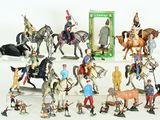 a lot of figurines that are sitting on a table