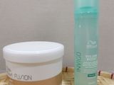 a bottle of lotion and a container of lotion sitting on a table