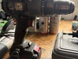 a cordless drill that is sitting on a table