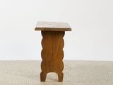 an image of a small wooden table on a tiled floor