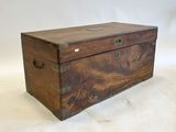 a wooden box that is sitting on a white surface
