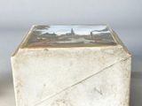 a small box with a picture on it sitting on a table