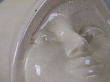 a close up of a statue of a woman ' s face