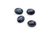 a set of four dark blue glass pebbles on a white surface