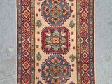 an old rug with a colorful design on it