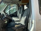 an image of the inside of a van with the driver ' s seat up