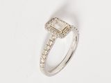 an image of a diamond ring on a white surface