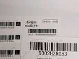 two labels on the back of a laptop computer