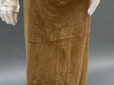 an image of a mannequin wearing a brown skirt and white shirt