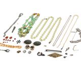 many different types of jewelry on a white surface
