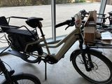 a bike that is parked in a garage with a box on the back of it