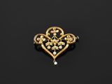 a gold and pearl broochle