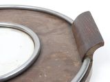 a close up of a metal object with a mirror on it