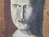 painting of a woman ' s face on a piece of wood