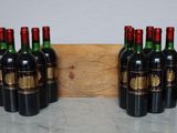 six bottles of wine are lined up in a row on a table