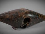 a close up of a metal object with a hole in it