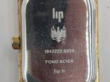a close up of a wrist watch on a white surface