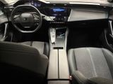 the interior of a car with a steering wheel, dashboard, and dashboard controls
