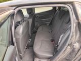 the back seats of a car are dirty with dirt on the floor