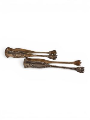 two wooden spoons with metal handles on a white background