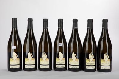 six bottles of wine are lined up in a row