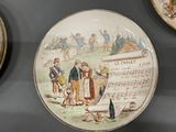 a plate with a picture of a man and a woman on it