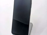 a cell phone that is sitting on top of a stand