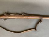a rifle that is laying on top of a table