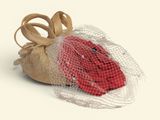 a bag with a red rose inside of it on a white surface