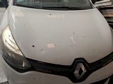 a picture of a white car parked in a garage