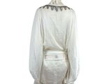 an image of a mannequin dressed in a white outfit