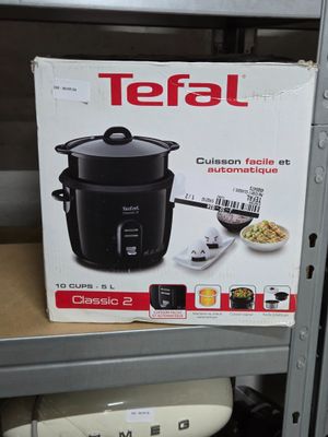 a box of a rice cooker on a shelf in a store