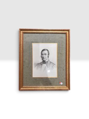 portrait d'un homme en costume-cravate dans un cadre doré