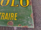 a green and yellow sign that says polo on it