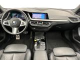 the interior of a bmw car with a steering wheel and dashboard