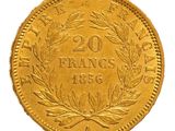 a close up of a gold coin on a white background
