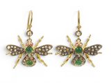 an image of a pair of gold earrings with green and white stones