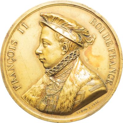 une image représentant une médaille d'or sur laquelle figure le portrait d'un homme portant un chapeau