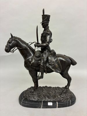statue of a man on a horse with a sword in his hand