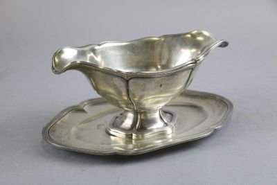 a silver plate with a saucer and a saucer on it