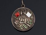a close up of a medal on a black surface