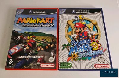 two nintendo wii games are sitting on a table