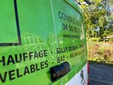 a green van that is parked on the side of the road