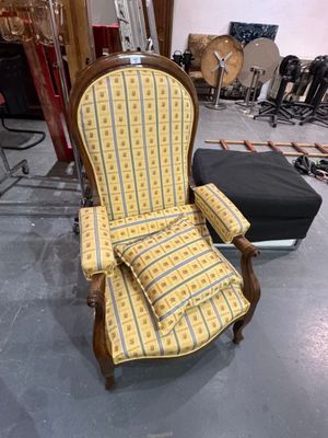 a chair that is sitting in the middle of a room